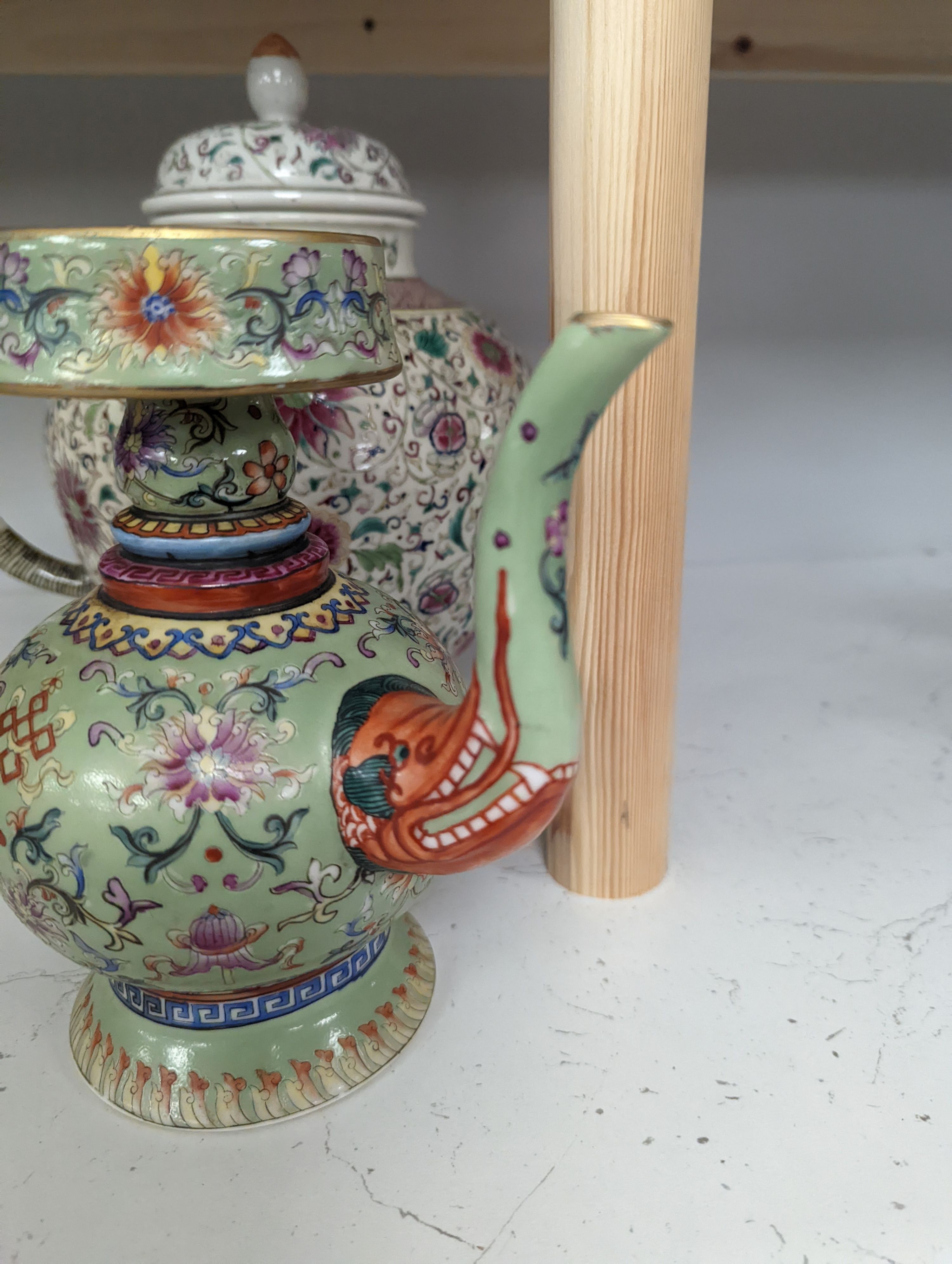 A large 19th century Chinese famille rose wine pot, and another wine pot, tallest 27cm